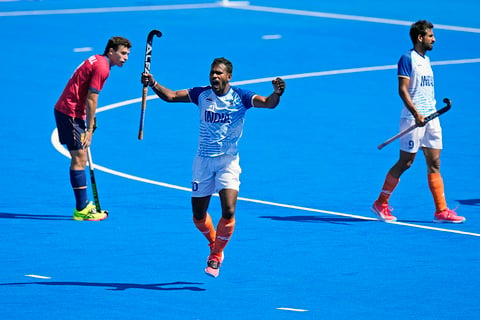 Amit Rohidas celebrates after winning the men's bronze medal